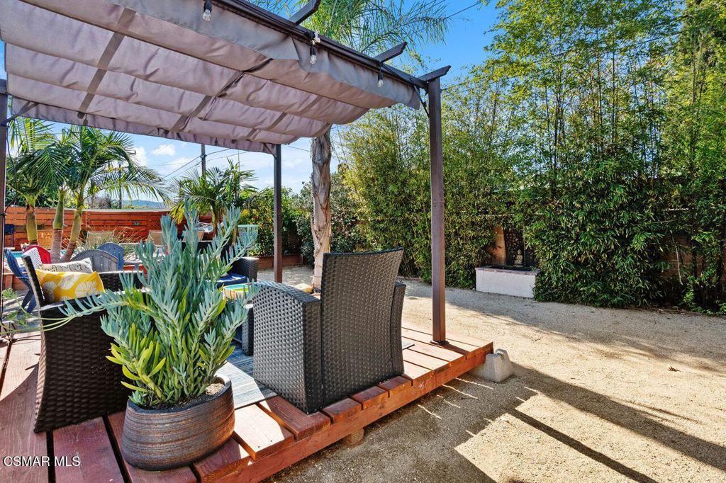 1135 Donner Avenue Simi Valley, CA 93065 - Photo 42 of 48 a view of a patio with table and chairs potted plants