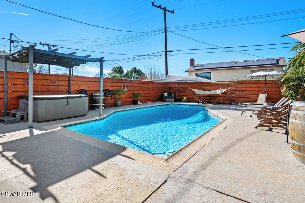 1135 Donner Avenue Simi Valley, CA 93065 - Photo 46 of 48 a view of a swimming pool with a patio