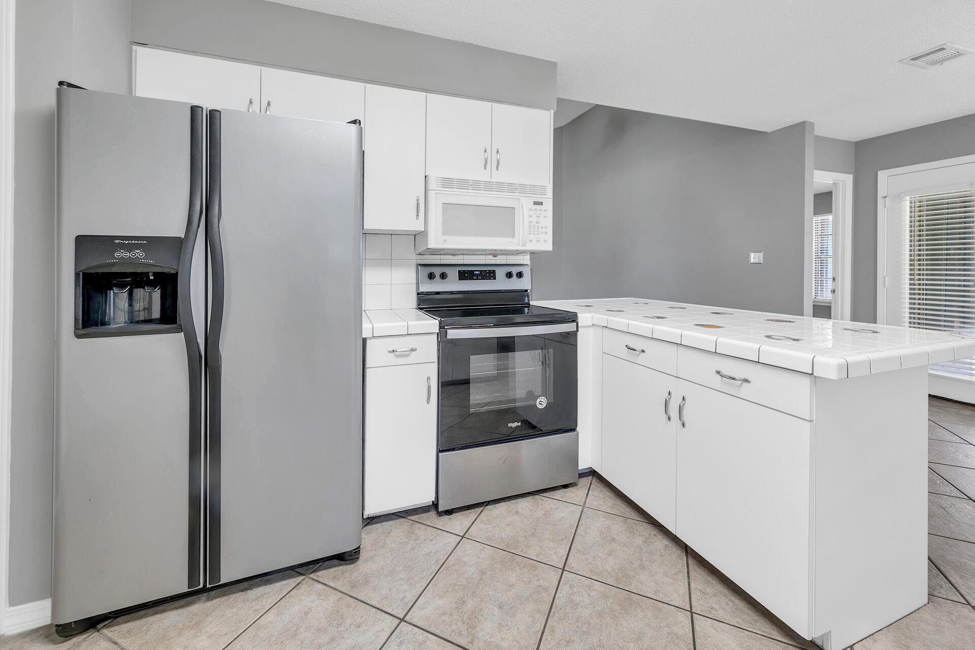 326 Sailfish Circle Destin, FL 32541 - Photo 11 of 28 a kitchen with a stove sink and refrigerator