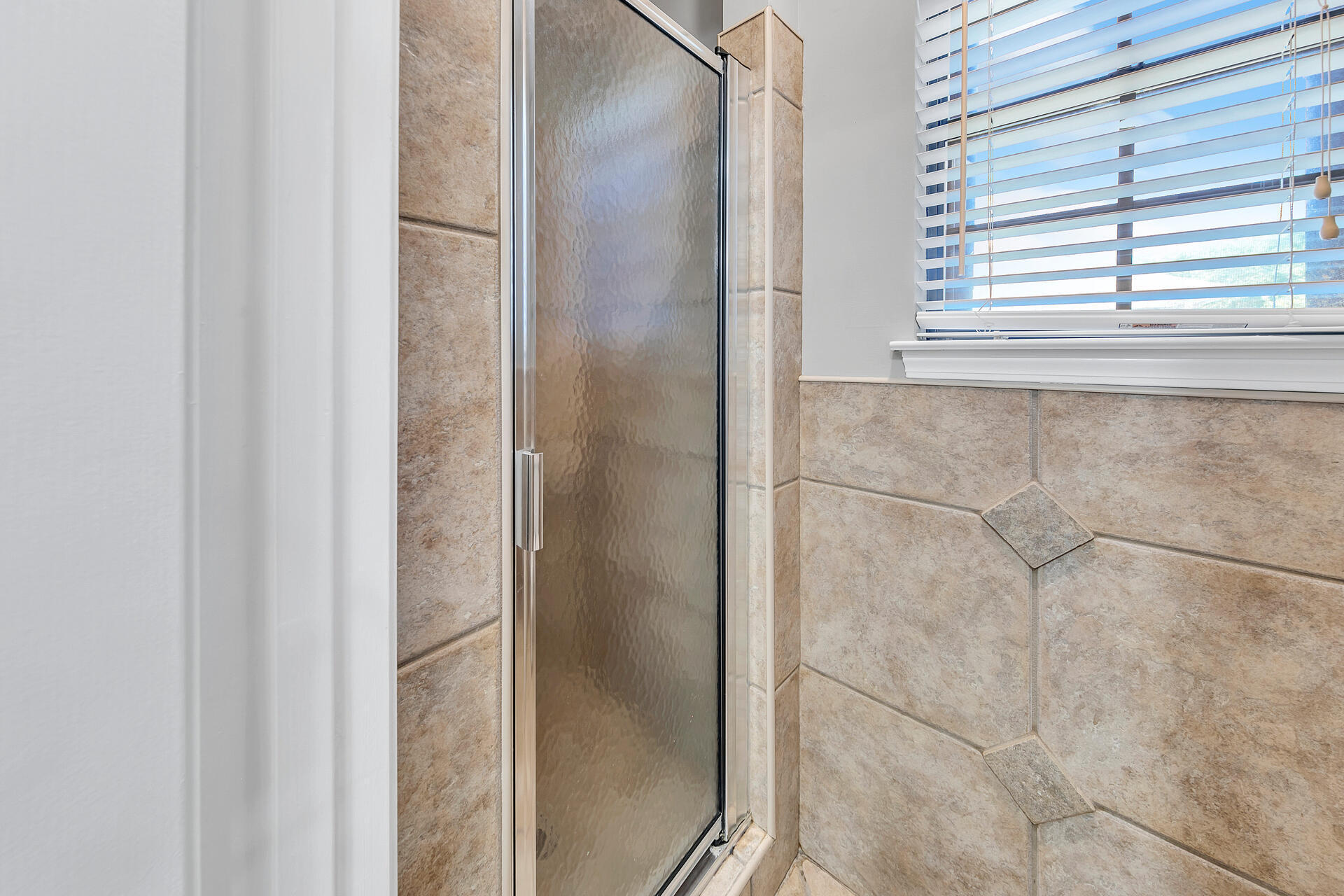 326 Sailfish Circle Destin, FL 32541 - Photo 18 of 28 a bathroom with a glass shower door