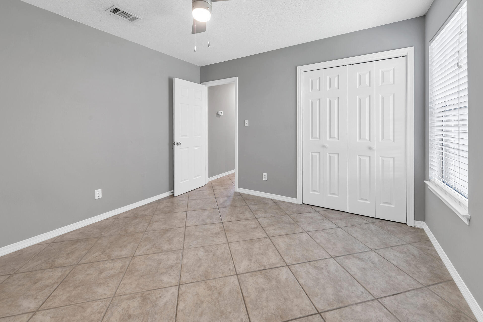 326 Sailfish Circle Destin, FL 32541 - Photo 20 of 28 a view of an empty room with a window