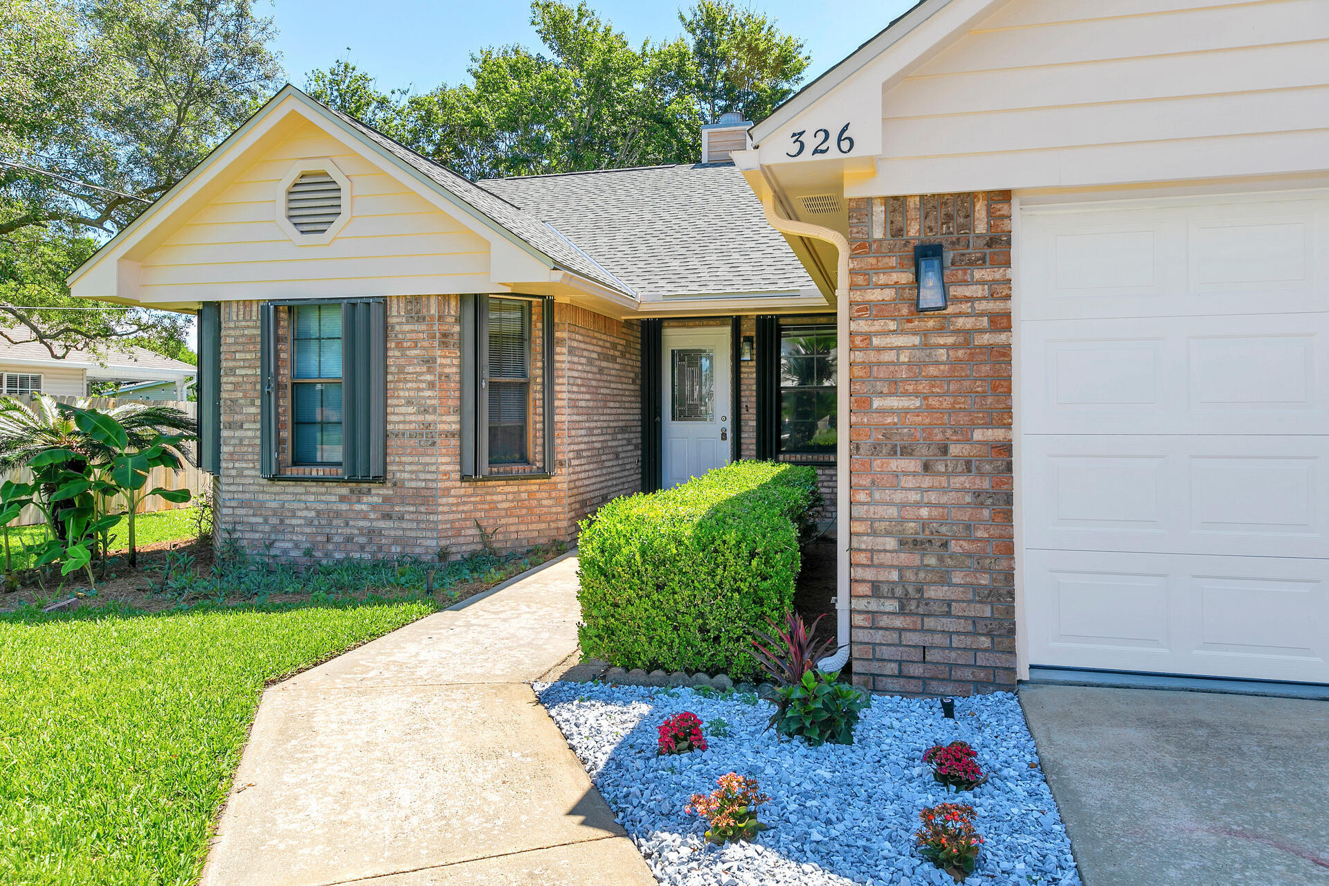 326 Sailfish Circle Destin, FL 32541 - Photo 2 of 28 a front view of a house with garden