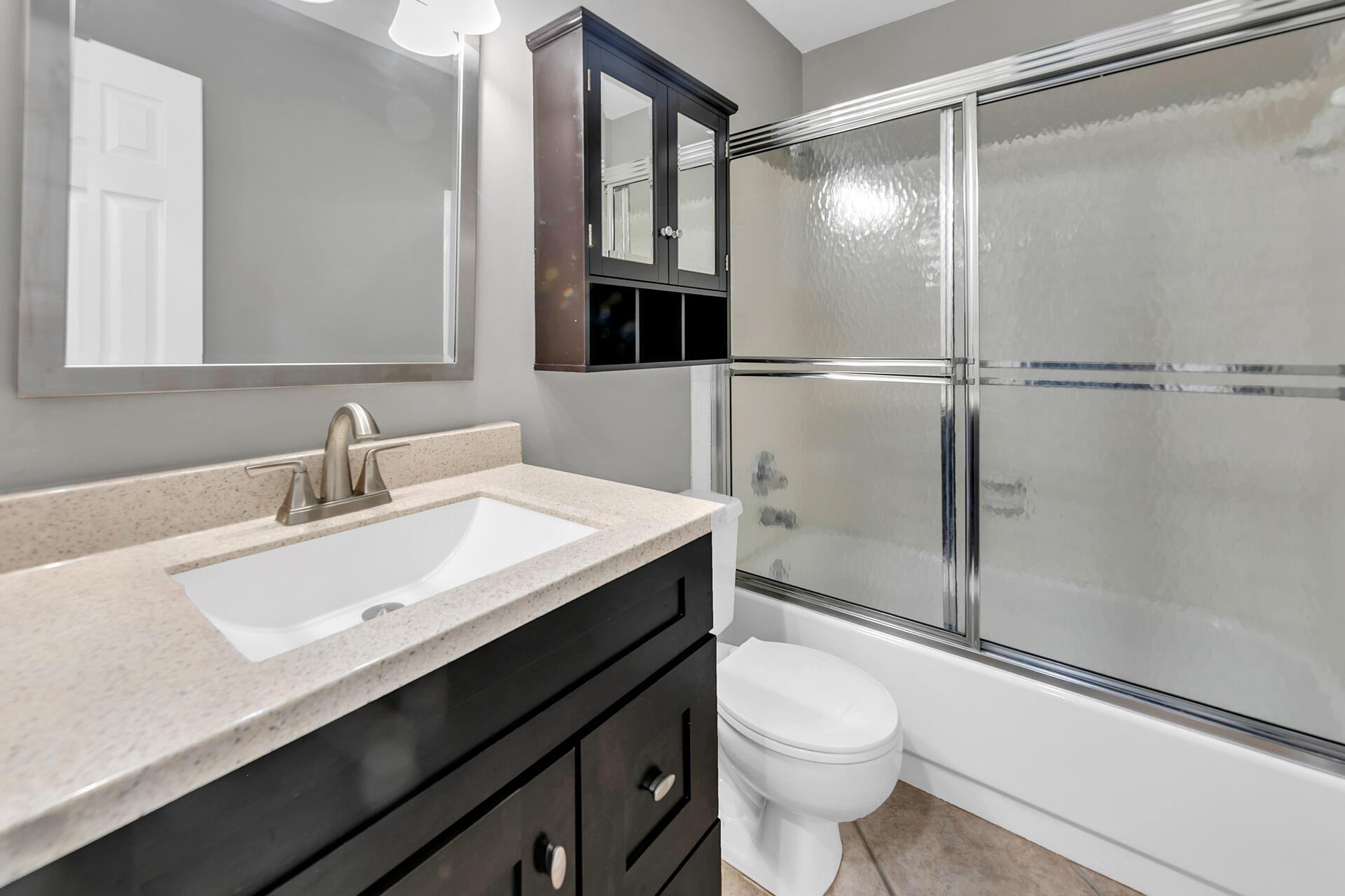 326 Sailfish Circle Destin, FL 32541 - Photo 23 of 28 a bathroom with a sink a toilet a mirror and shower