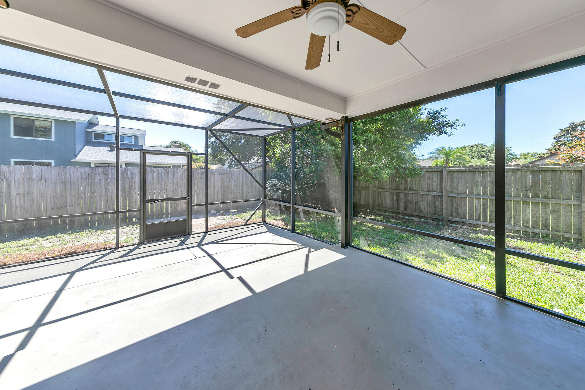 326 Sailfish Circle Destin, FL 32541 - Photo 27 of 28 a view of an empty room with sliding glass door