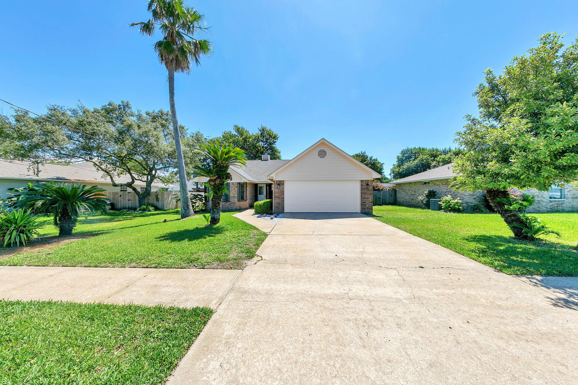 326 Sailfish Circle Destin, FL 32541 - Photo 4 of 28 a front view of a house with garden