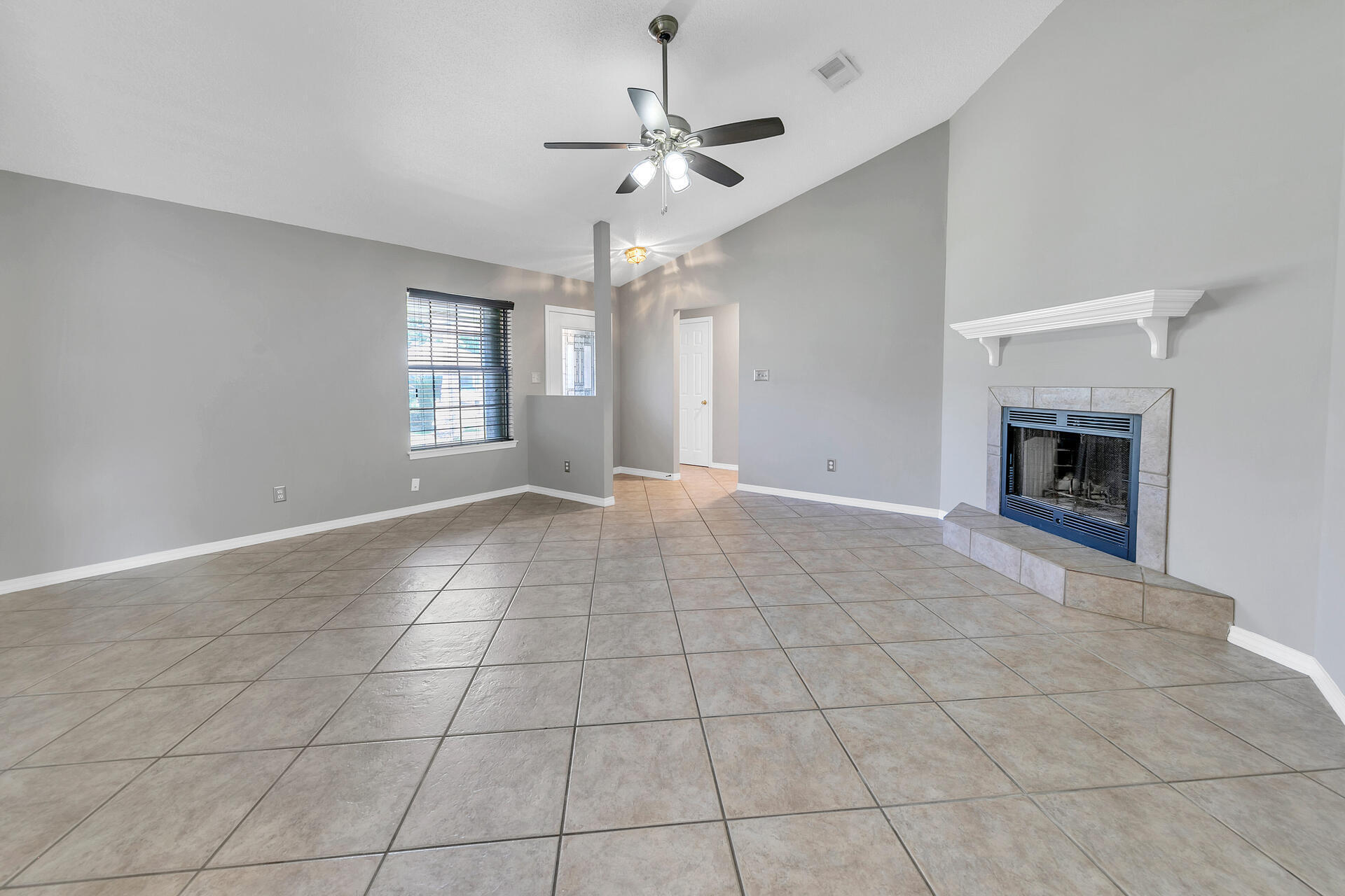 326 Sailfish Circle Destin, FL 32541 - Photo 6 of 28 a view of livingroom with window fireplace and windows