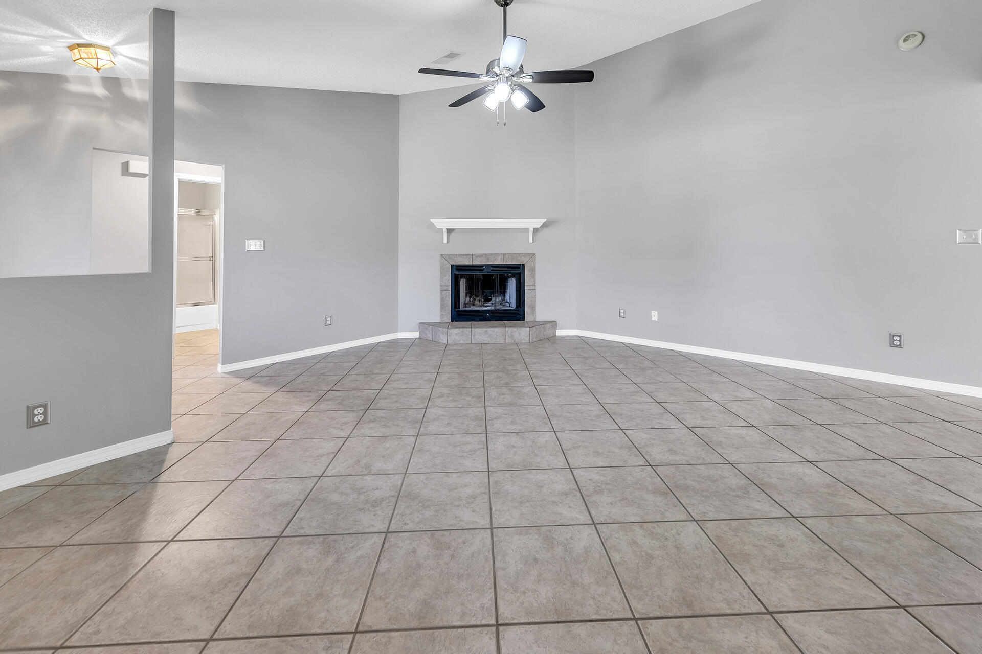 326 Sailfish Circle Destin, FL 32541 - Photo 8 of 28 a view of an empty room with a fireplace