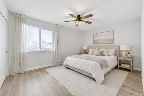 a bedroom with a large bed and a window
