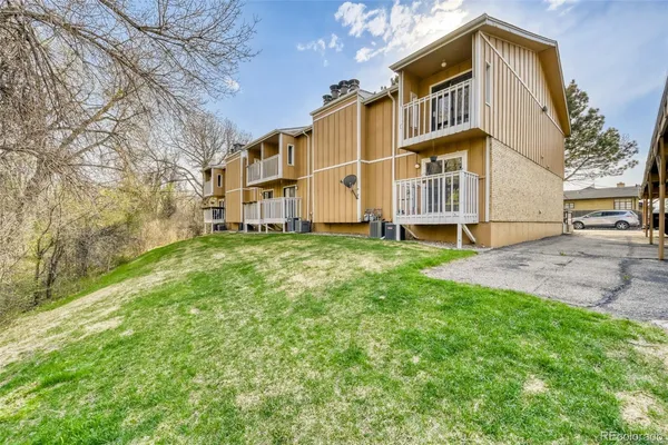 a view of a big yard with large trees