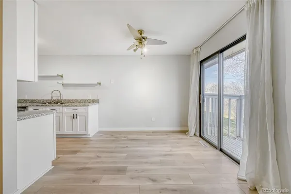 a kitchen with kitchen island a counter top space a sink and appliances