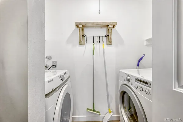 a view of livingroom with washer and dryer