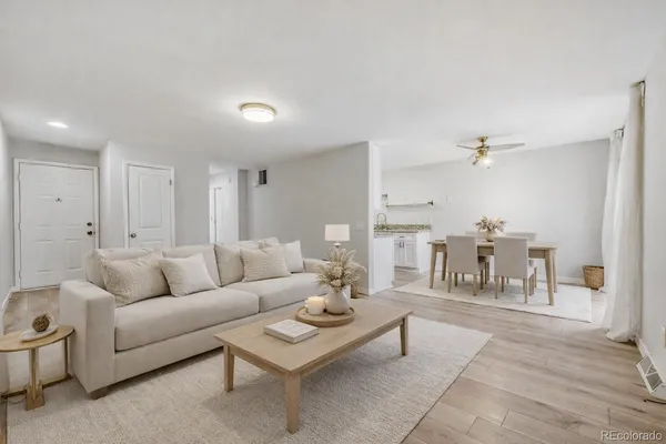 a living room with furniture and a table