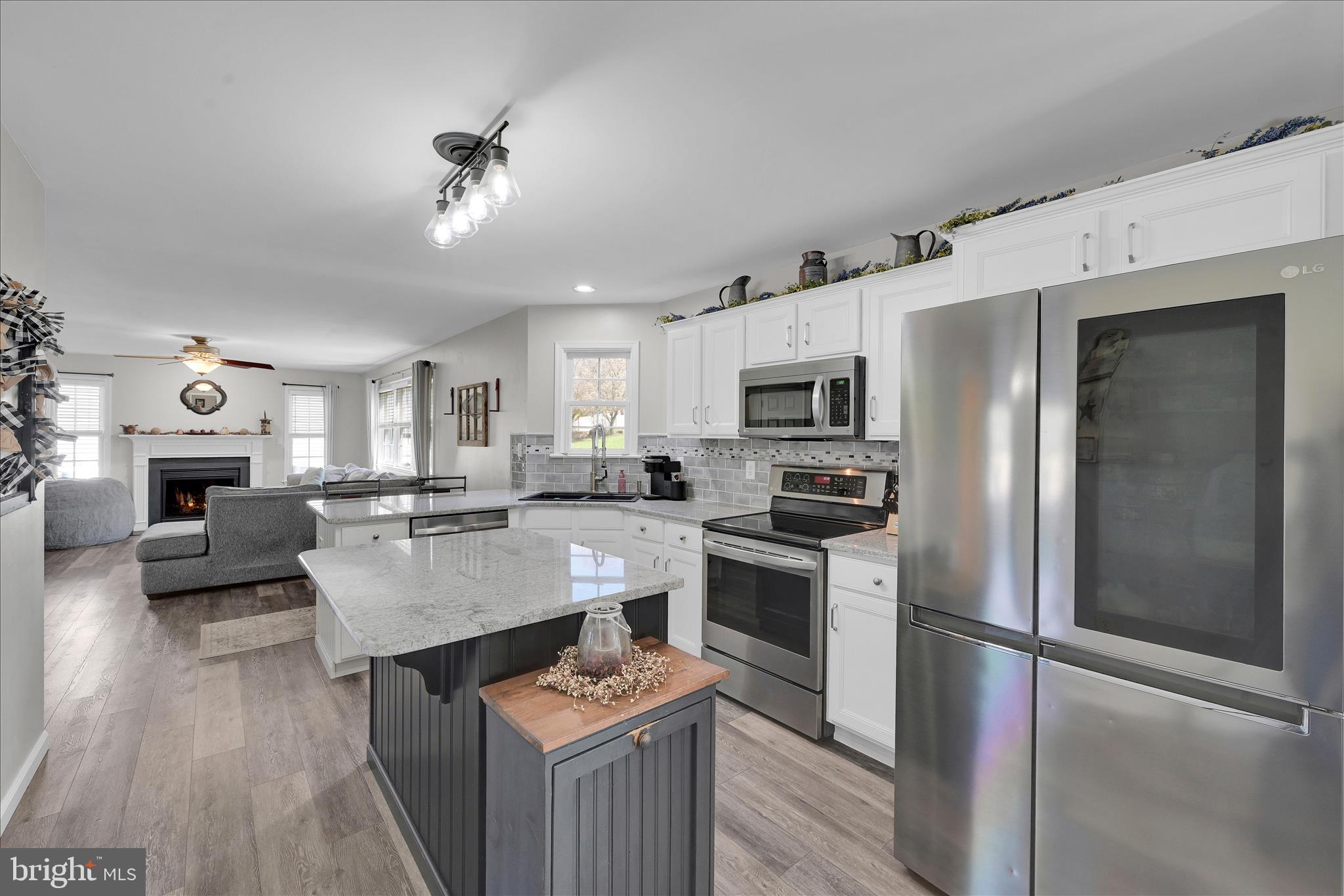 111 Holly Road Orwigsburg, PA 17961 - Photo 15 of 46 a kitchen with stainless steel appliances granite countertop a stove refrigerator and a sink