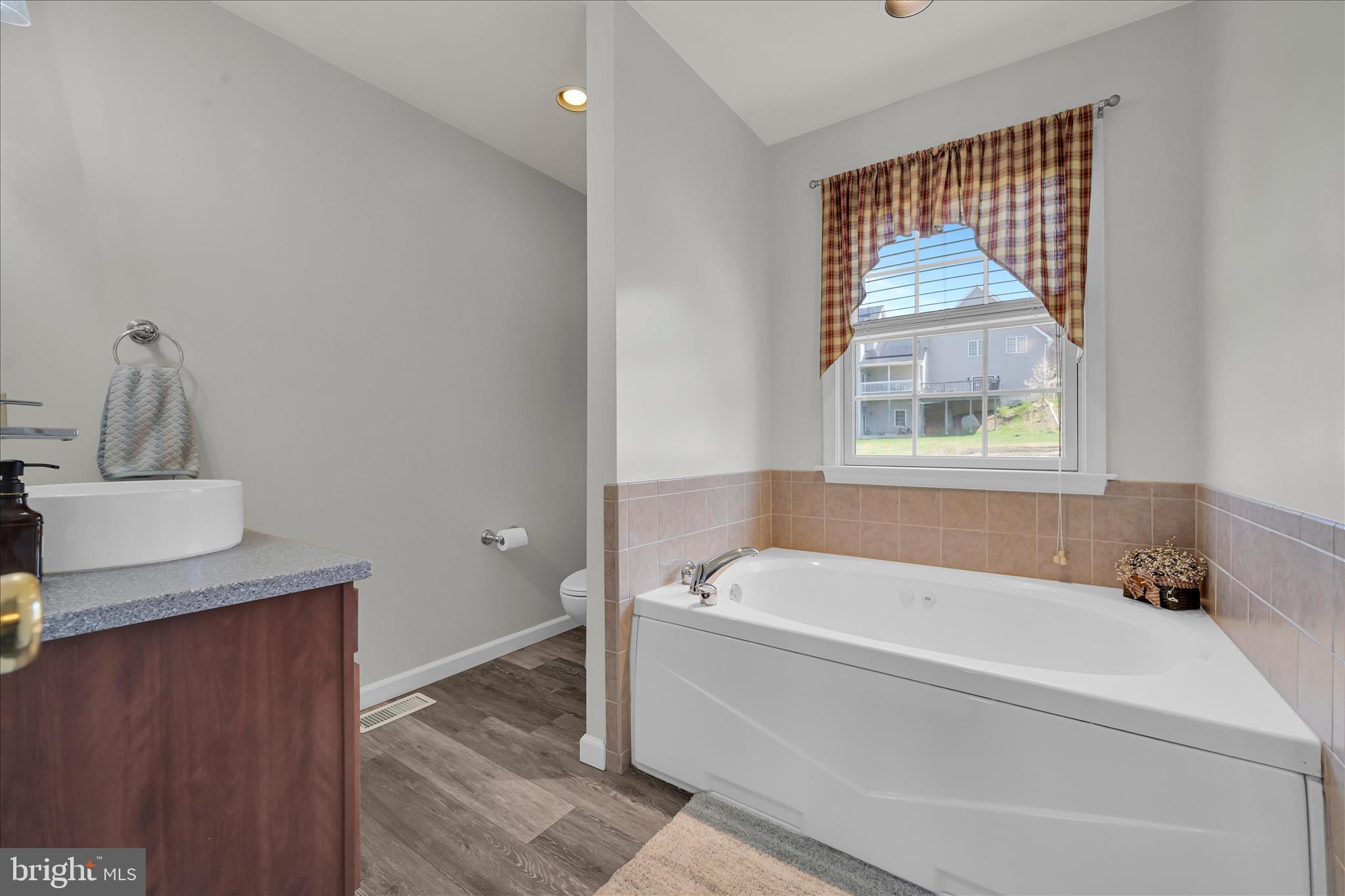 111 Holly Road Orwigsburg, PA 17961 - Photo 26 of 46 a bathroom with a tub sink and mirror