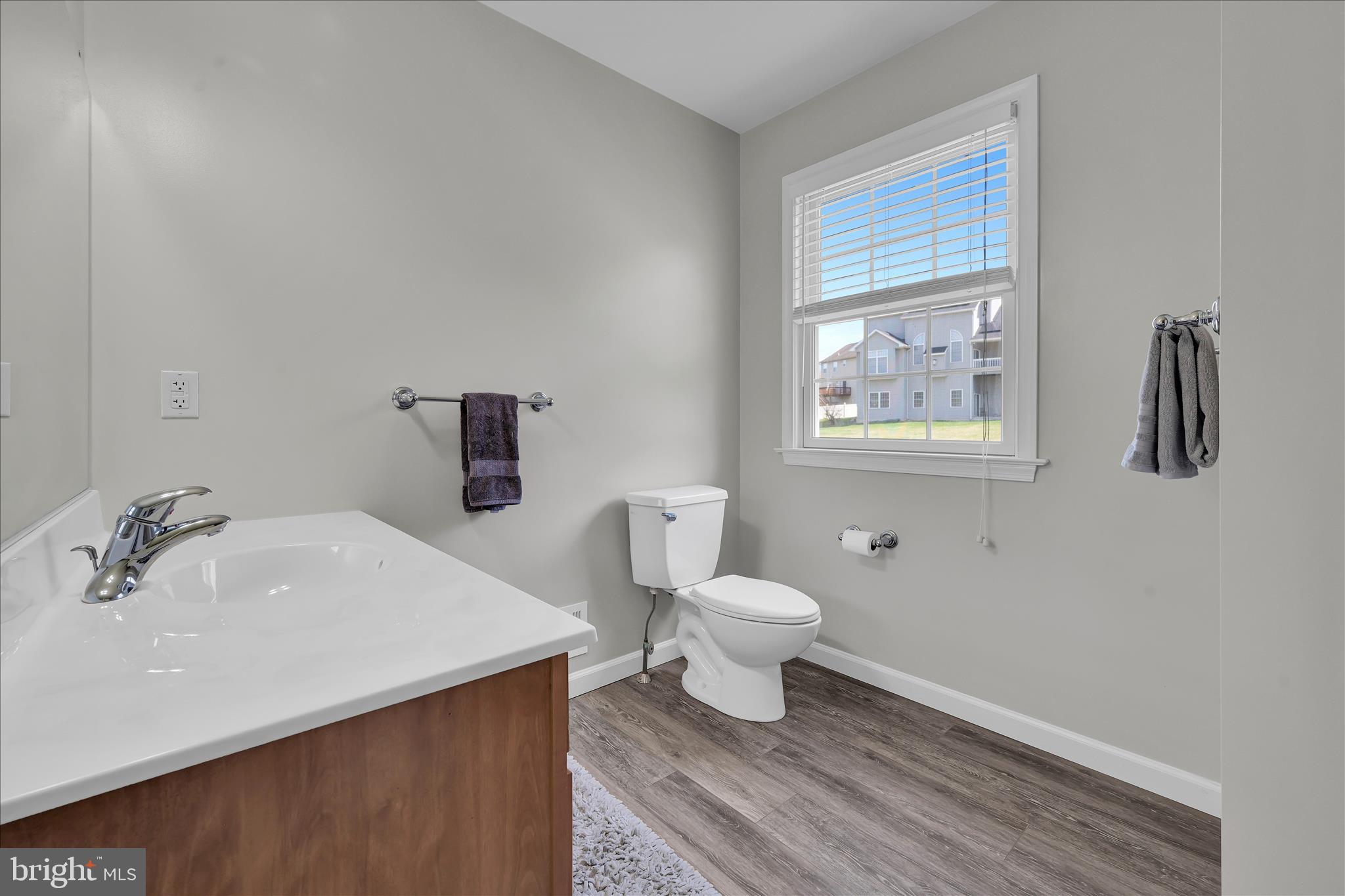 111 Holly Road Orwigsburg, PA 17961 - Photo 31 of 46 a bathroom with a sink toilet and a window