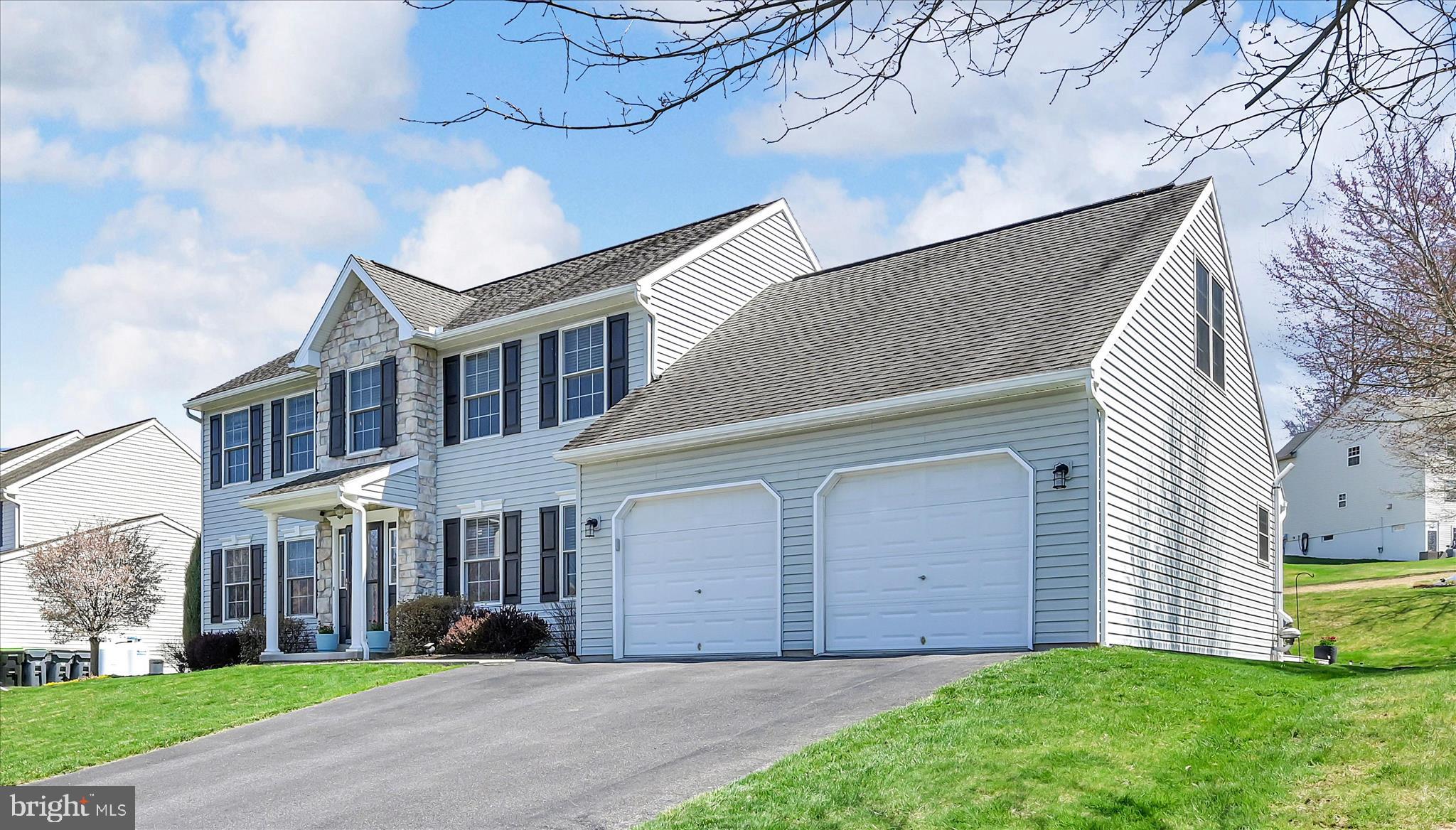 111 Holly Road Orwigsburg, PA 17961 - Photo 7 of 46 a front view of a house with a yard and garage