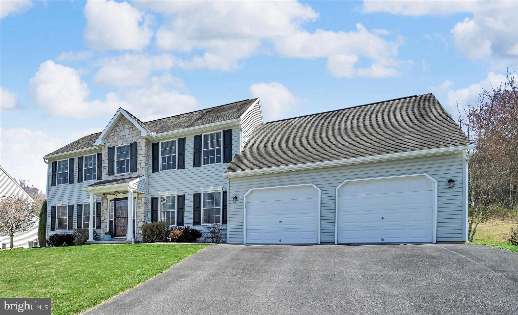 111 Holly Road Orwigsburg, PA 17961 - Photo 9 of 46 a front view of a house with a yard and garage