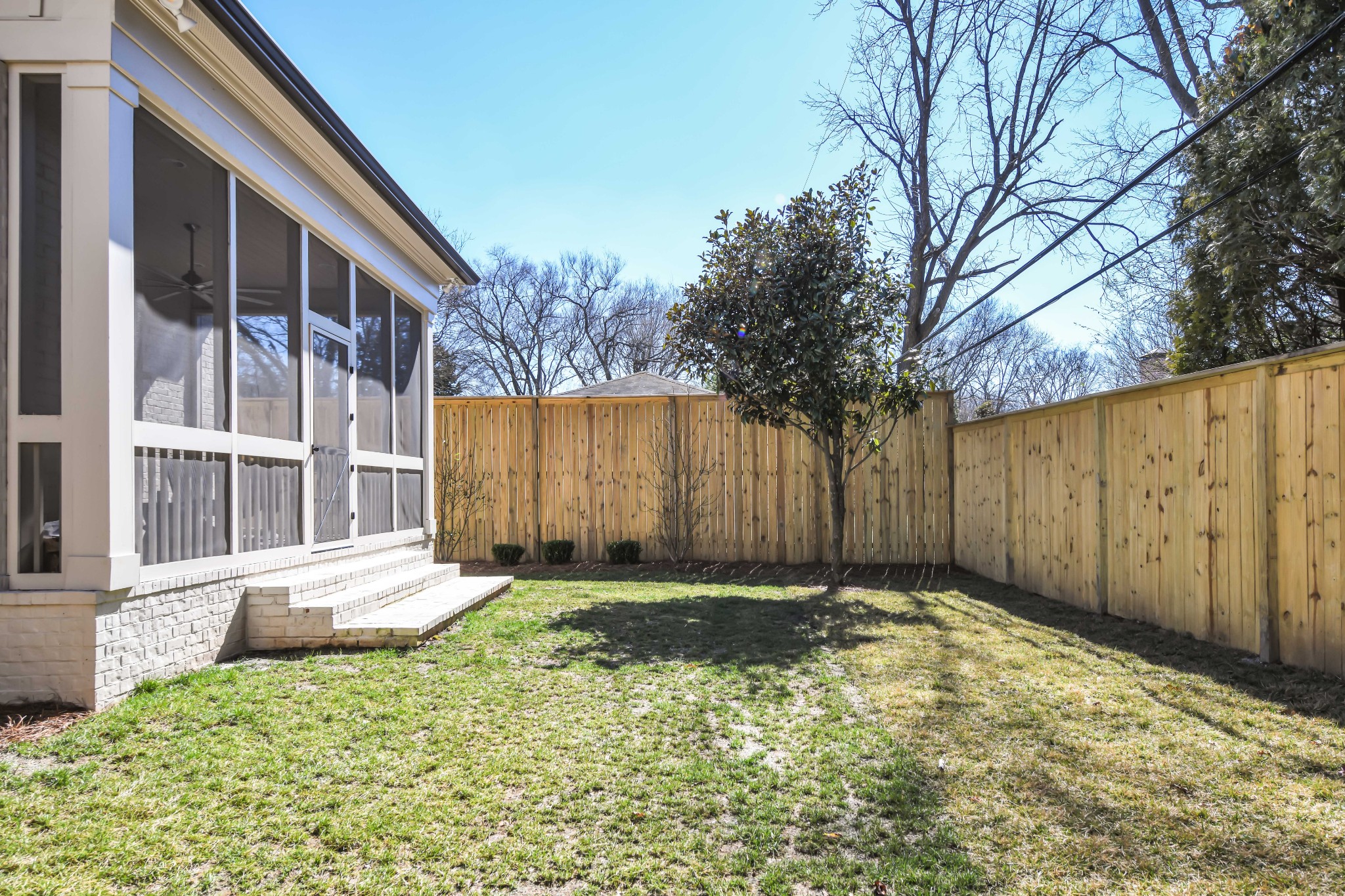 211B Page Road Nashville, TN 37205 - Photo 42 of 43 a view of backyard with large trees and wooden fence