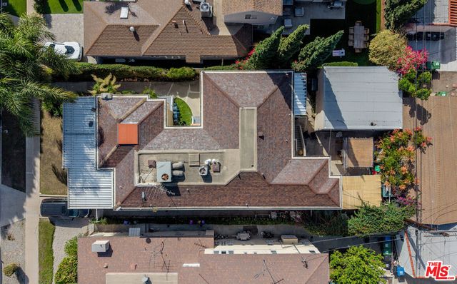 an aerial view of a house with a garden