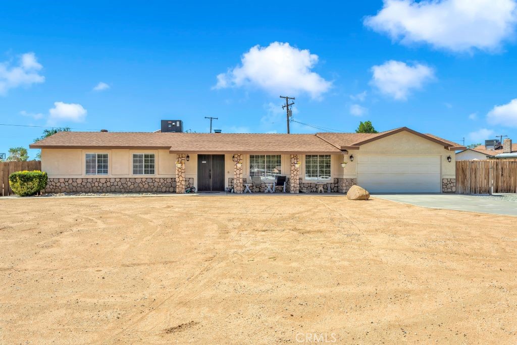 19015 Haida Road Apple Valley, CA 92307 - Photo 1 of 1 a front view of a house with a yard and garage
