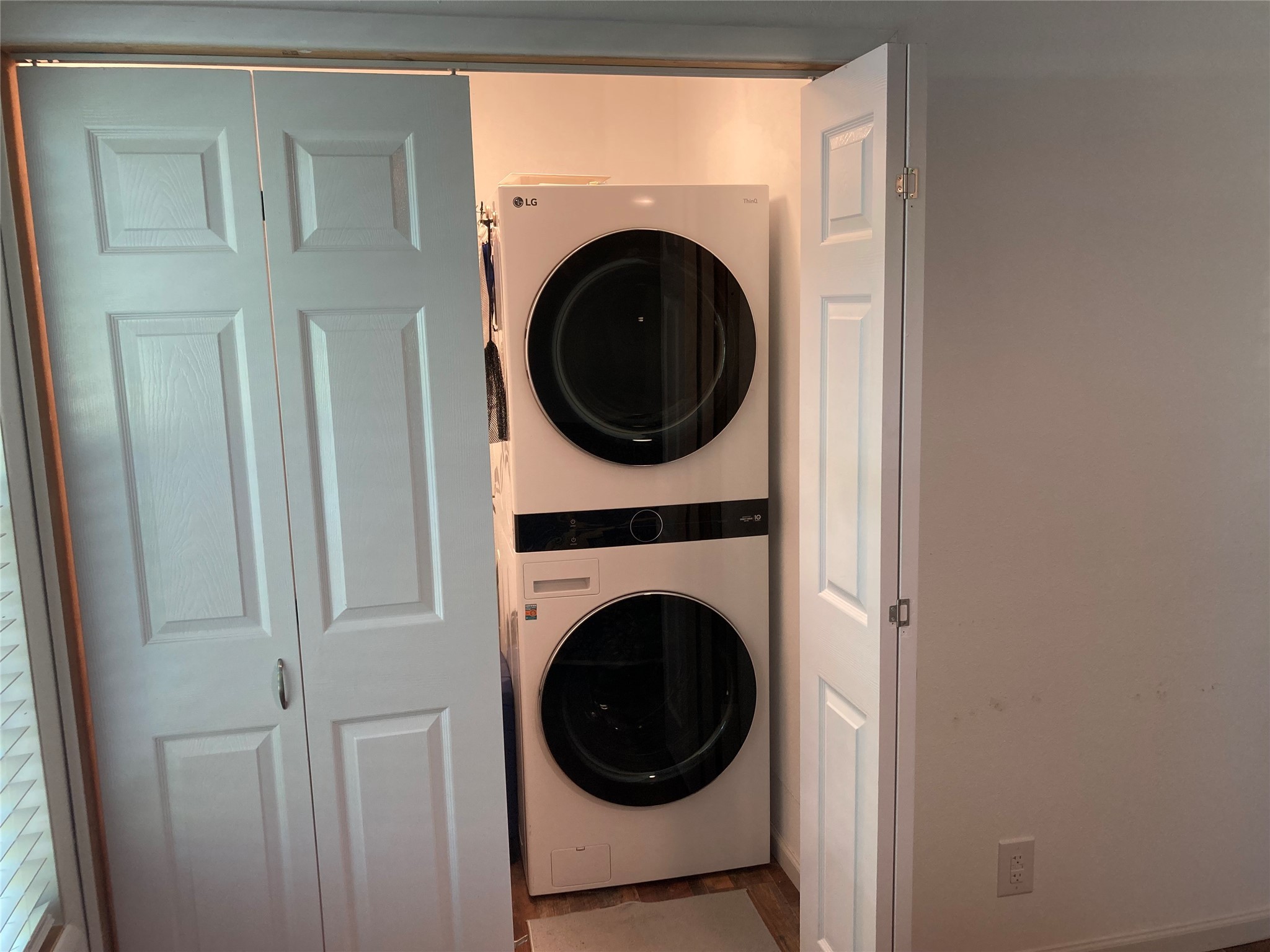 142 Walnut Ridge Livingston, TX 77351 - Photo 11 of 36 Convenient closet with stacked washer and dryer for easy laundry access.