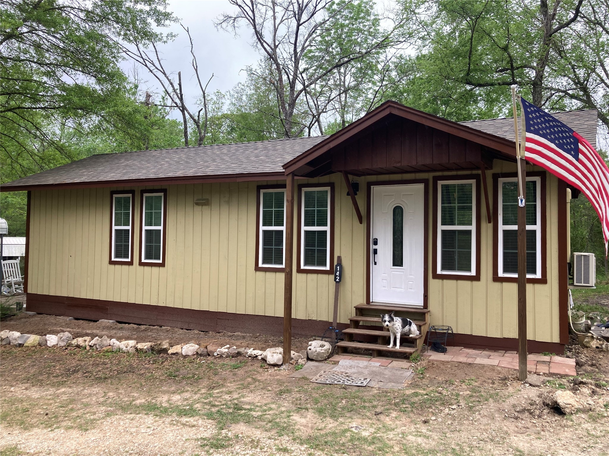 142 Walnut Ridge Livingston, TX 77351 - Photo 17 of 36 Charming and inviting home with a welcoming porch and surrounded by lush greenery. Perfect for those seeking comfort and tranquility.