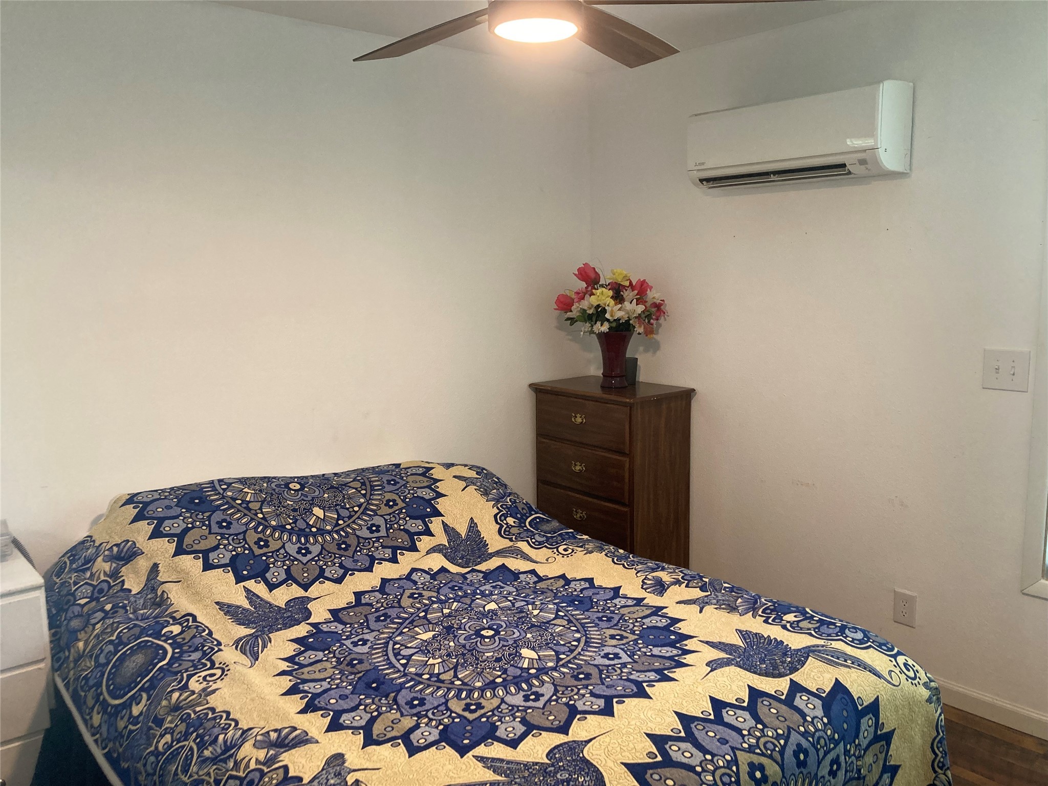 142 Walnut Ridge Livingston, TX 77351 - Photo 9 of 36 Cozy bedroom featuring a modern ceiling fan, ample storage, and efficient air conditioning for ultimate comfort.