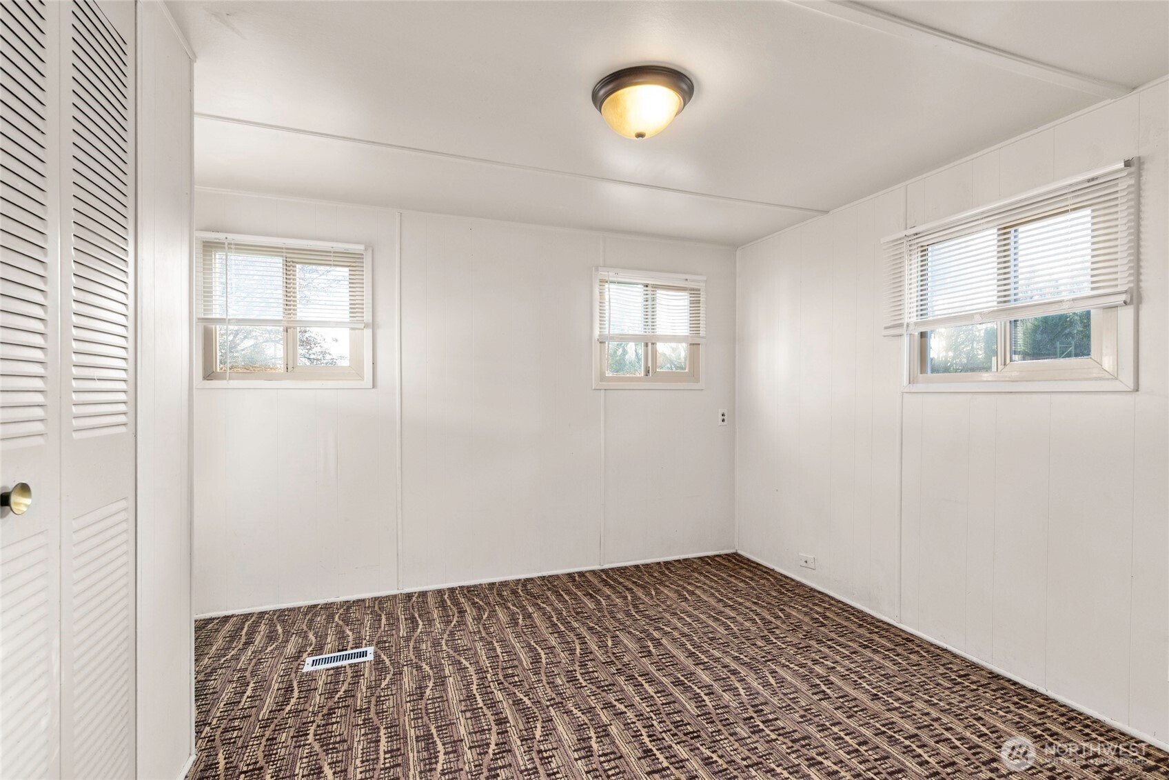 1617 Fones Road Southeast, Unit 47 Olympia, WA 98501 - Photo 11 of 15 an empty room with windows