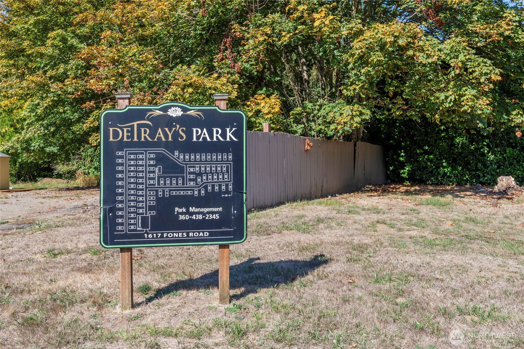 1617 Fones Road Southeast, Unit 47 Olympia, WA 98501 - Photo 14 of 15 a sign that is sitting on a brick wall