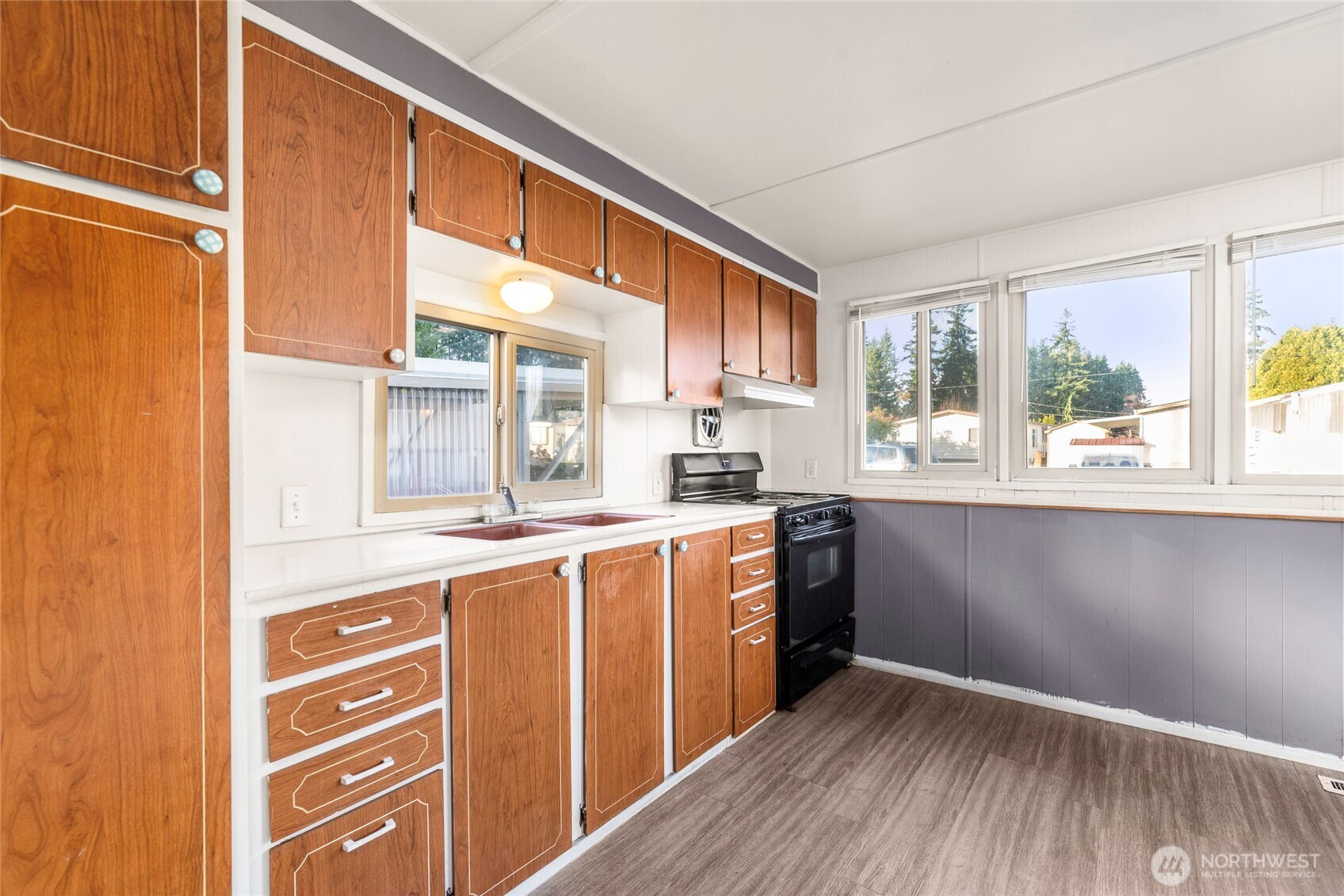 1617 Fones Road Southeast, Unit 47 Olympia, WA 98501 - Photo 6 of 15 a kitchen with stainless steel appliances granite countertop a sink and wooden cabinets