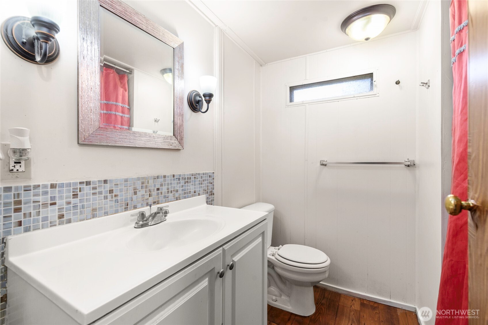 1617 Fones Road Southeast, Unit 47 Olympia, WA 98501 - Photo 10 of 15 a bathroom with a sink a toilet and a mirror