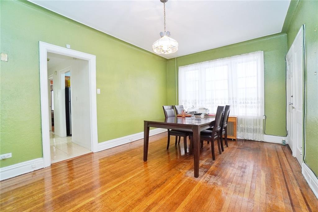 157 Sullivan Place Brooklyn, NY 11225 - Photo 14 of 28 a view of a dining room with furniture and wooden floor