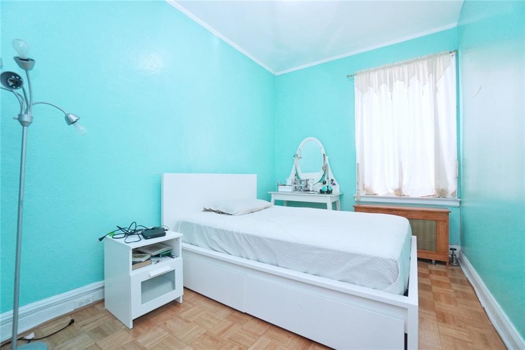 157 Sullivan Place Brooklyn, NY 11225 - Photo 16 of 28 a bedroom with a bed and a window