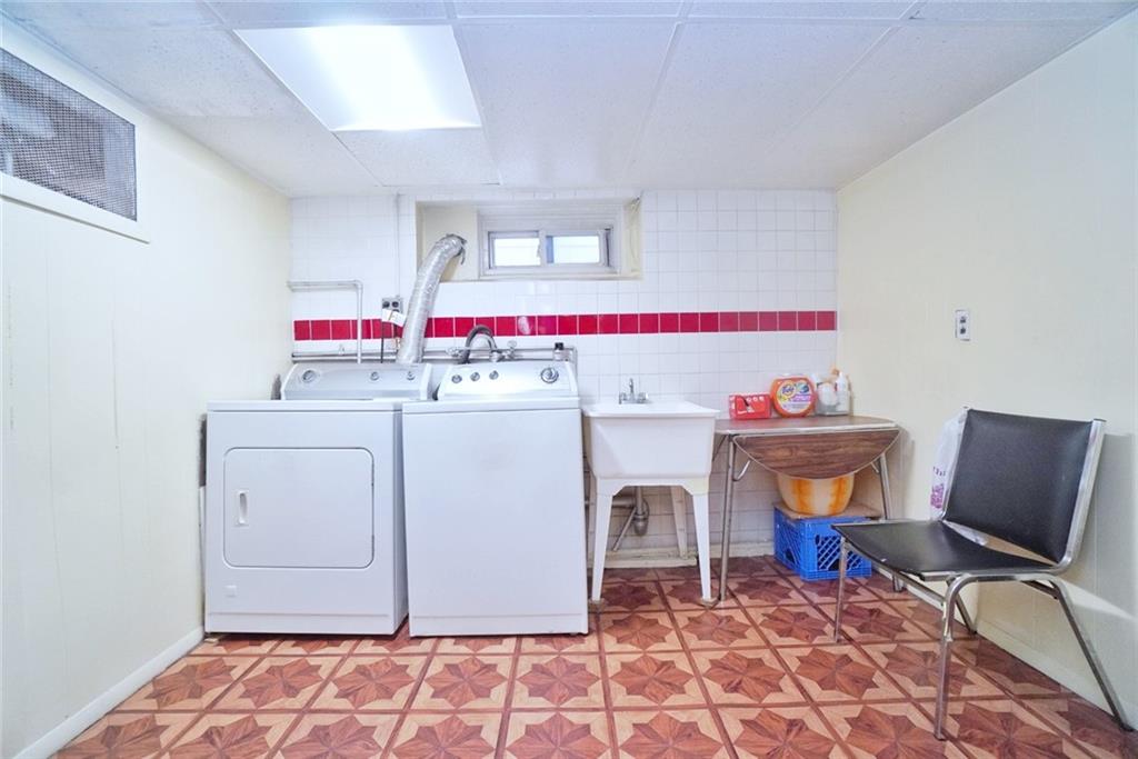 157 Sullivan Place Brooklyn, NY 11225 - Photo 23 of 28 a utility room with dryer and washer