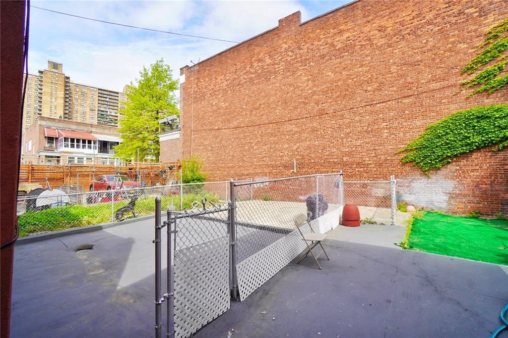 157 Sullivan Place Brooklyn, NY 11225 - Photo 27 of 28 a view of a chairs and table in the patio