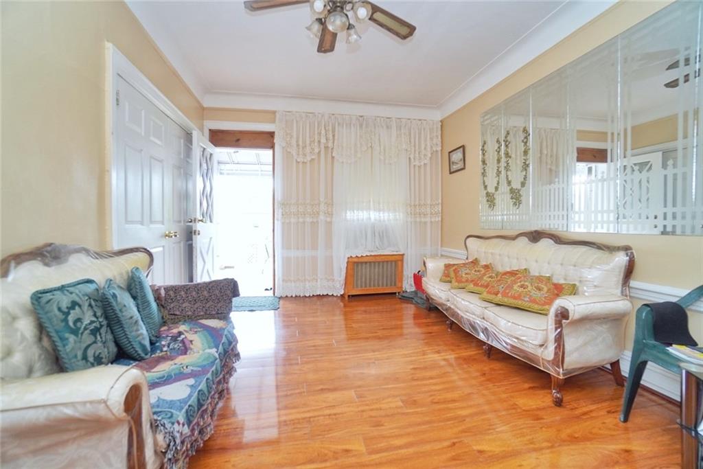 157 Sullivan Place Brooklyn, NY 11225 - Photo 3 of 28 a living room with furniture and a large window