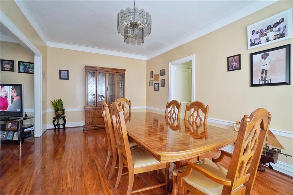 157 Sullivan Place Brooklyn, NY 11225 - Photo 4 of 28 a view of a dining room with furniture and wooden floor