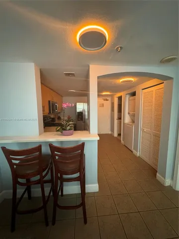 a view of a room with furniture and window