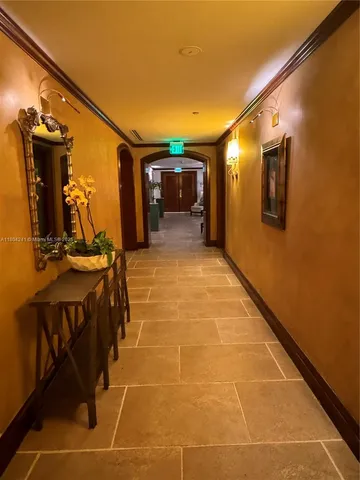 a view of a hallway with seating area