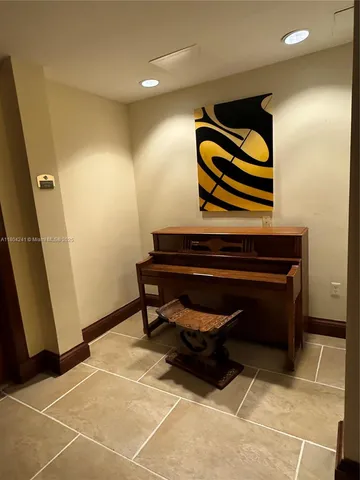 a room with wooden floor and furniture