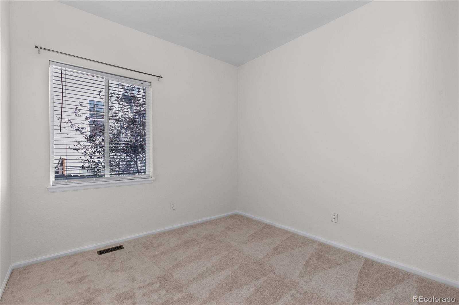 8166 Wetherill Circle Castle Pines, CO 80108 - Photo 34 of 49 an empty room with a window