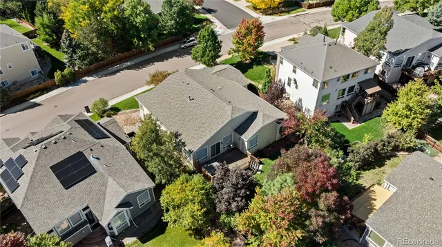 an aerial view of a house with outdoor space