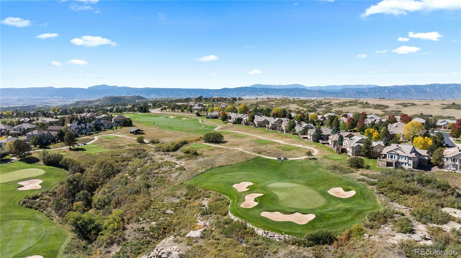 8166 Wetherill Circle Castle Pines, CO 80108 - Photo 48 of 49 a view of a lake with a mountain