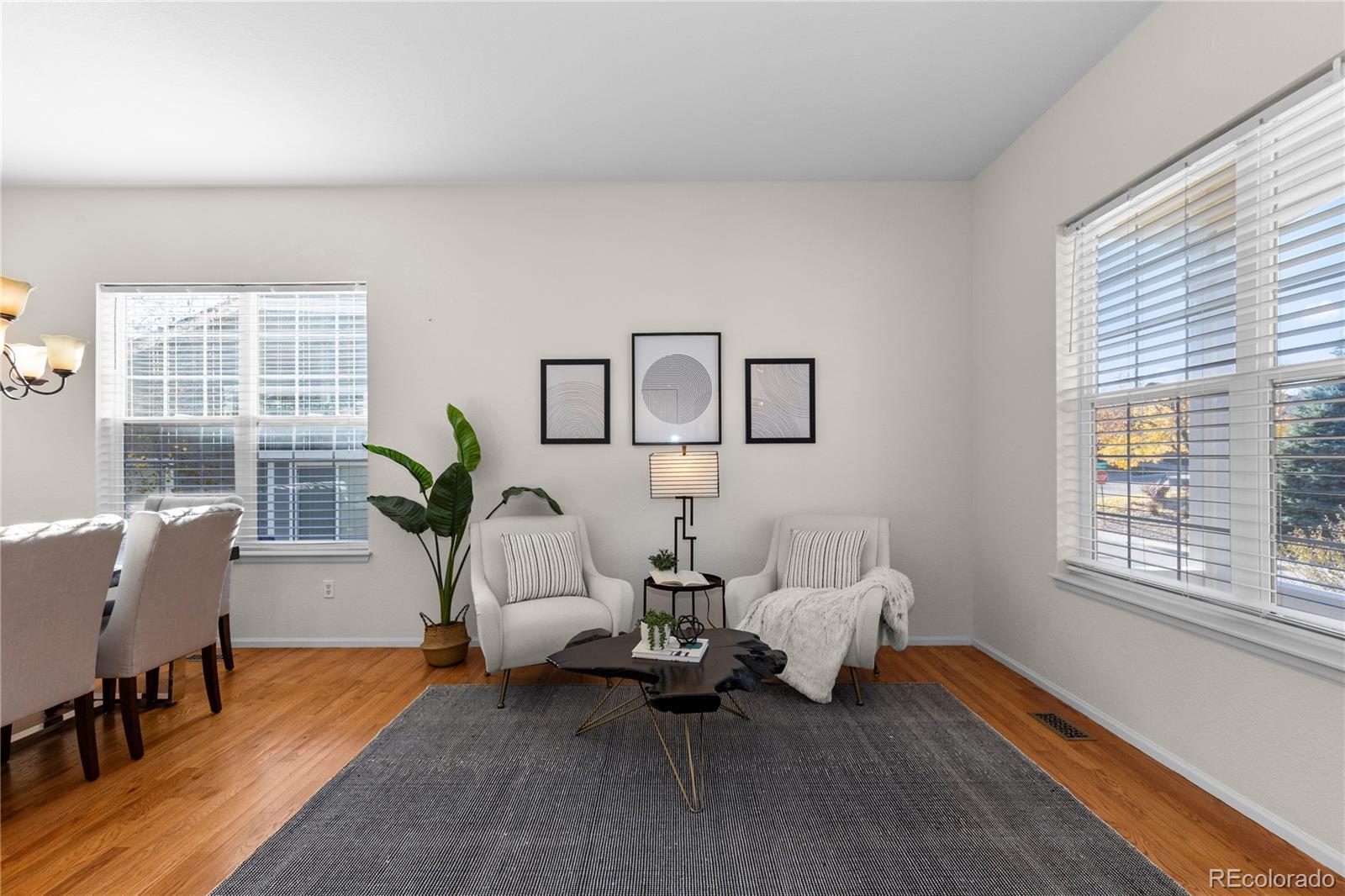 8166 Wetherill Circle Castle Pines, CO 80108 - Photo 6 of 49 a living room with furniture and a window