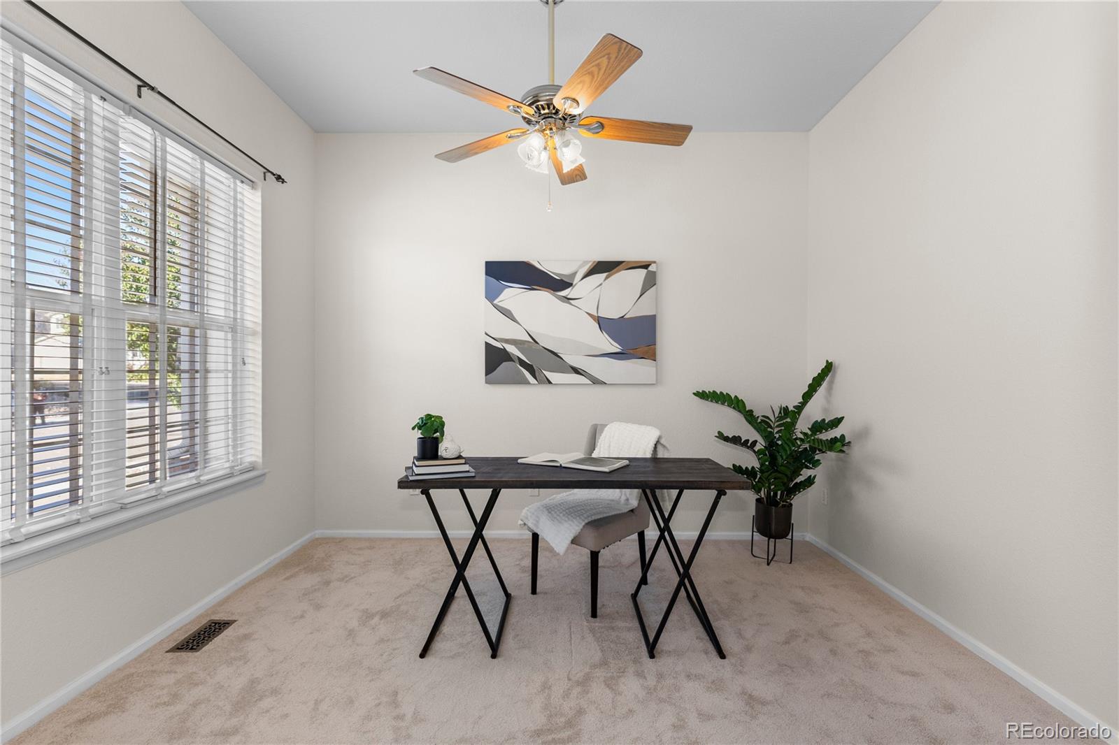8166 Wetherill Circle Castle Pines, CO 80108 - Photo 8 of 49 a view of a dining room with furniture and a large window