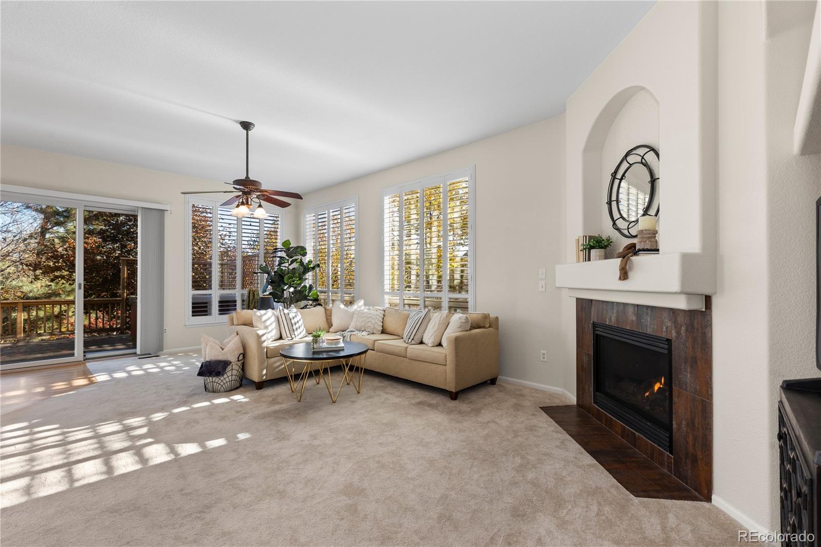8166 Wetherill Circle Castle Pines, CO 80108 - Photo 10 of 49 a living room with furniture and a fireplace