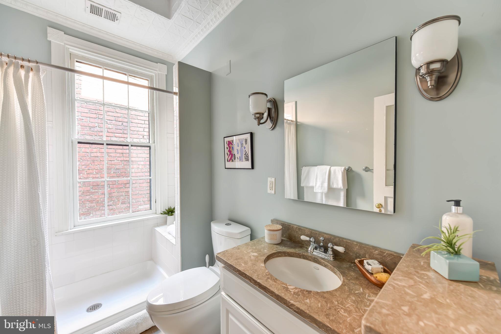 321 A Street Northeast Washington, DC 20002 - Photo 28 of 40 Hall bathroom w/easy-entry shower plus tin ceiling