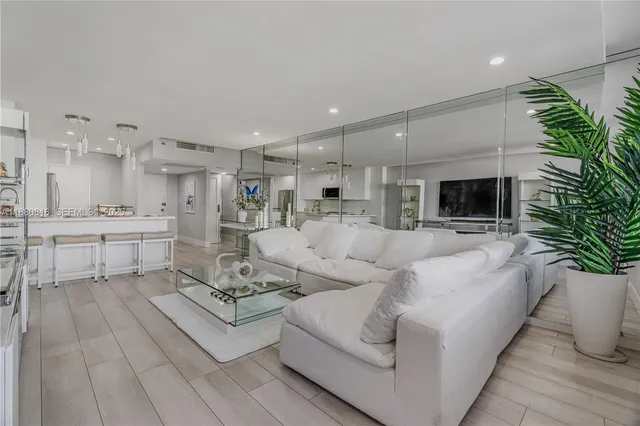 a bathroom with a granite countertop sink a toilet and bathtub