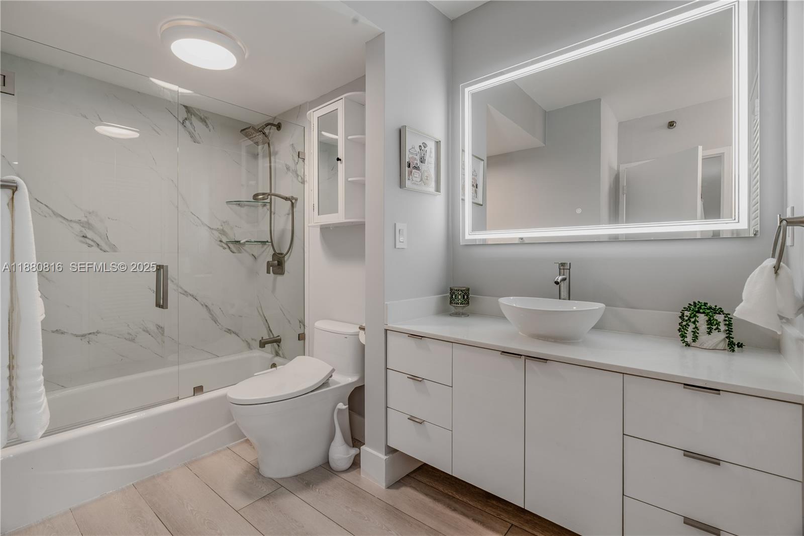 100 Lincoln Road, Unit 323 Miami Beach, FL 33139 - Photo 14 of 59 a bathroom with a granite countertop sink a toilet and bathtub