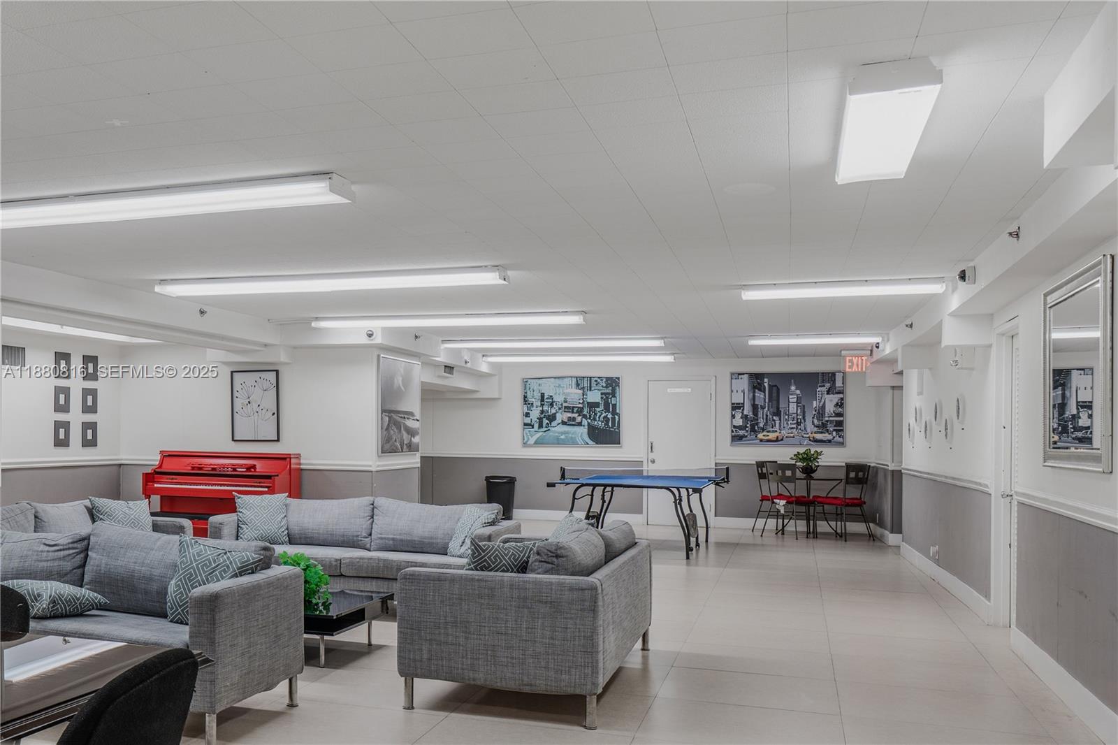 100 Lincoln Road, Unit 323 Miami Beach, FL 33139 - Photo 50 of 59 a living room with furniture and a large window